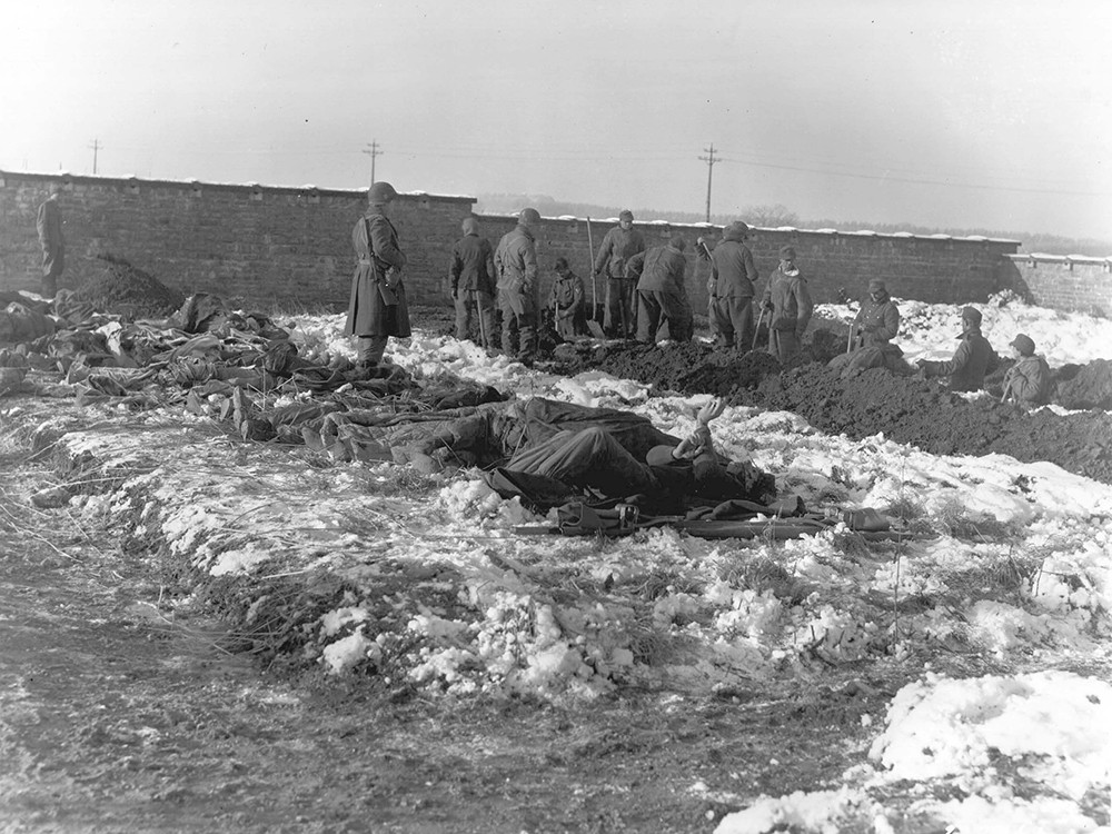 <p style="text-align: center;"><strong>German prisoners of war dig graves for members of the 101st Airborne Division who were killed defending Bastogne against the Germans.&nbsp;</strong><br style="text-align: center;" /><span style="text-align: center;">Source / Cr&eacute;dit :&nbsp;</span><a style="text-align: center;" href="https://history.army.mil/html/reference/bulge/botb_images_01.html" target="_blank" rel="noopener">U.S. Army Center of Military History</a></p>