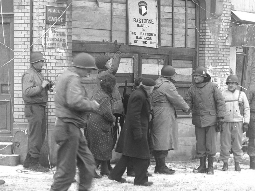 <p style="text-align: center;"><strong>Generals of the 101st Airborne Division review the 101st Div. in the town of Bastogne, Belgium - 18th January 1945.</strong><br style="text-align: center;" /><span style="text-align: center;">Source / Cr&eacute;dit :&nbsp;</span><a style="text-align: center;" href="101st_Division_in_Bastogne,_Belgium_-_NARA_-_12010179.jpg" target="_blank" rel="noopener">U.S. National Archives and Records Administration - Wikipedia CC</a></p>
